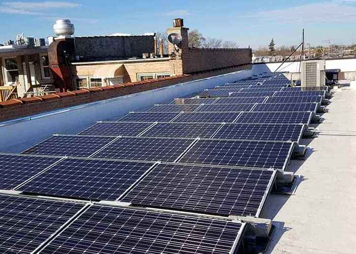 Kapital Electric, Inc. installed solar panels on a commercial building roof in Chicago, IL
